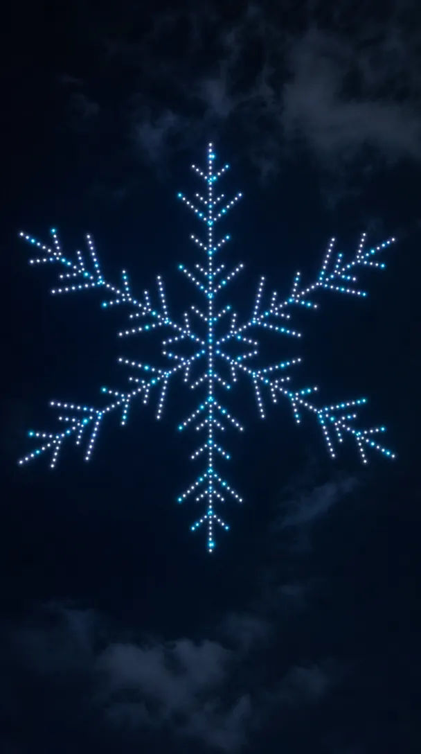 Drones forming a giant blue and white snowflake